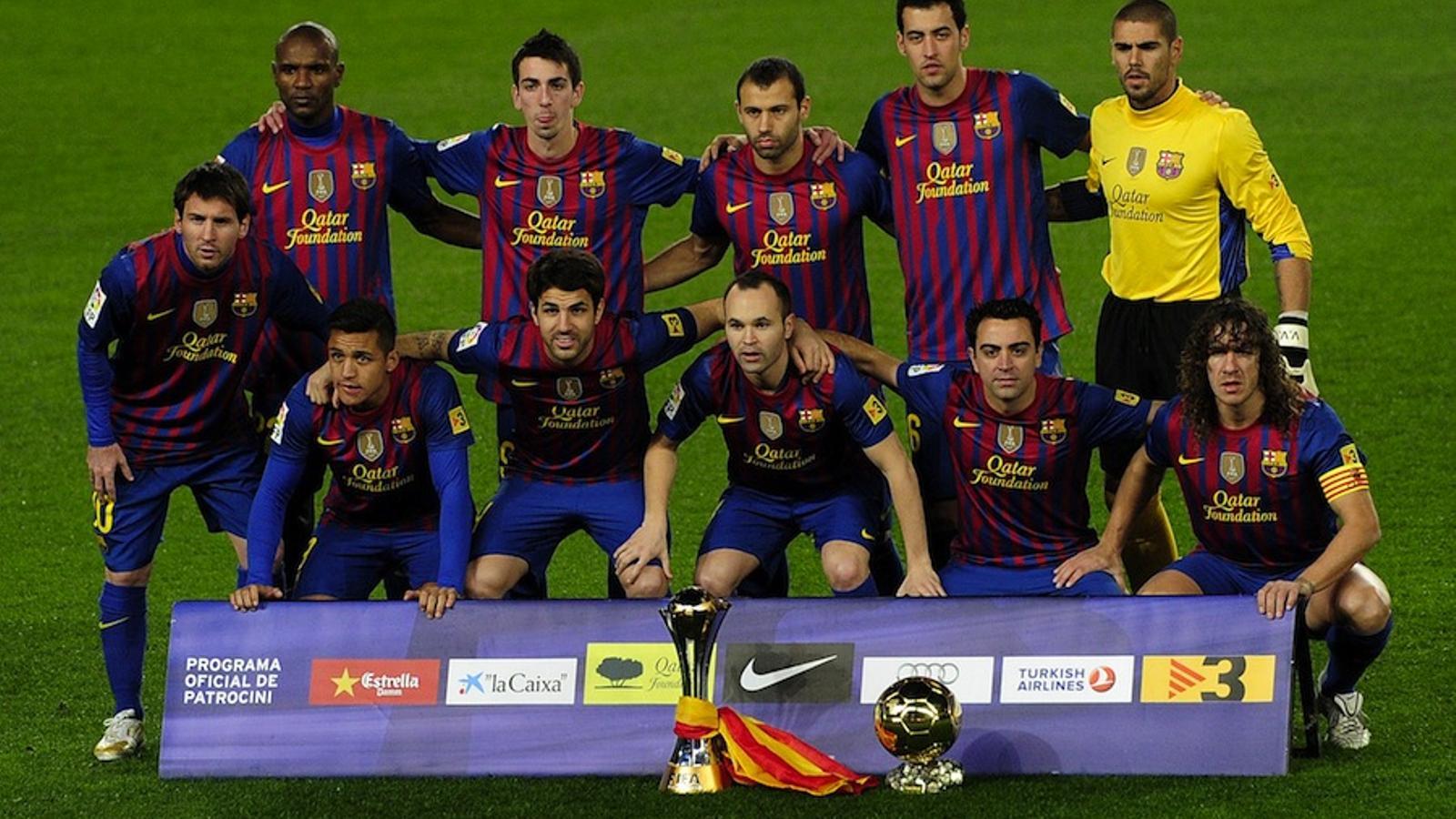 Els jugadors del Barça han ofert el Mundial de Clubs i Messi, la Pilota d'Or. JOSEP LAGO / AFP