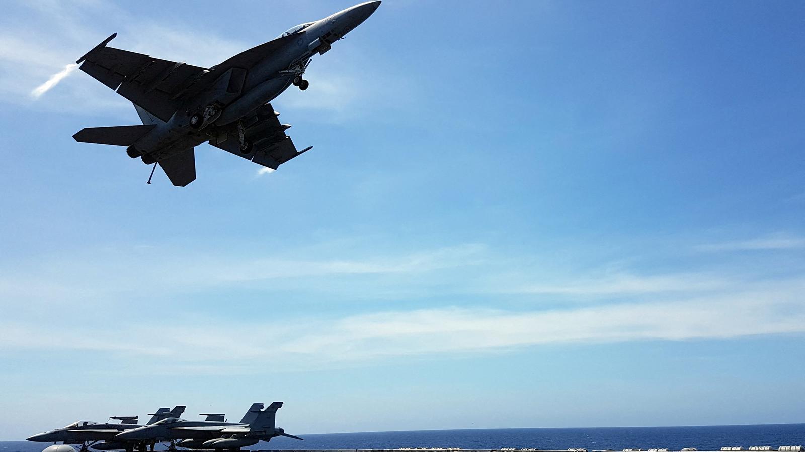 An F-18 fighter takes off from the aircraft carrier USS Theodore Roosevelt in an archive image.