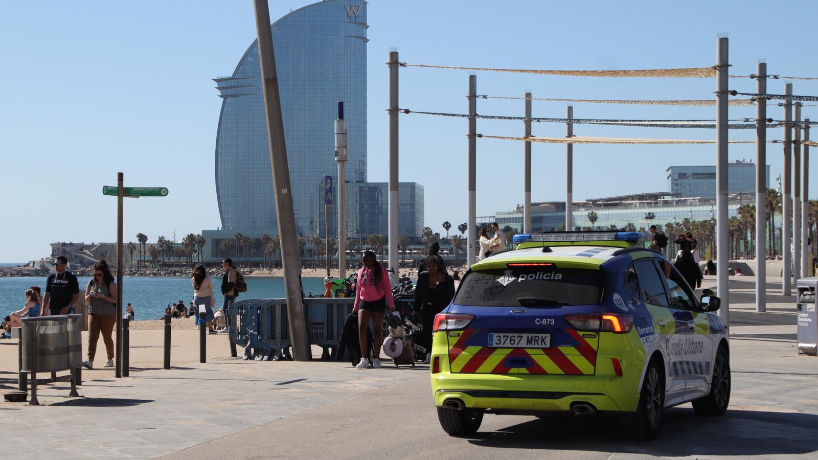 A patrol of the Guàrdia Urbana on the beach of Barcelona.