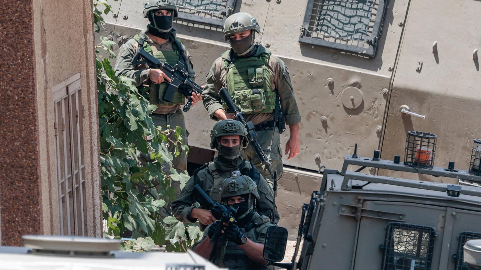 Members of Israeli forces participate in a raid in Tal, near Nablus, in the West Bank.