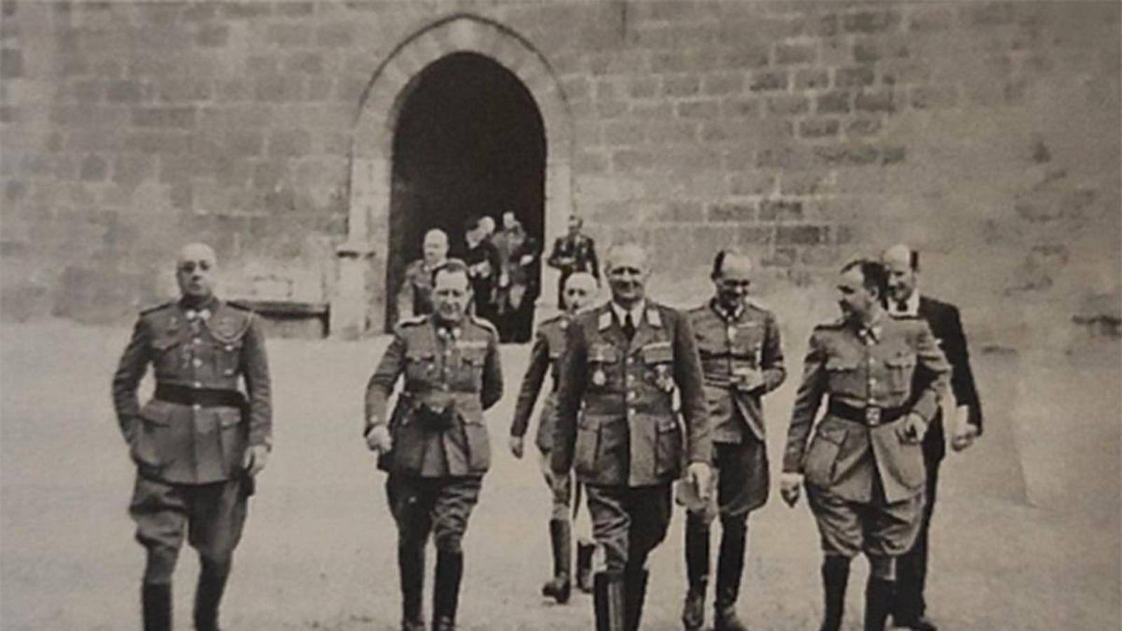Miquel Mateu in the 40s with Nazi military men at Peralada Castle.