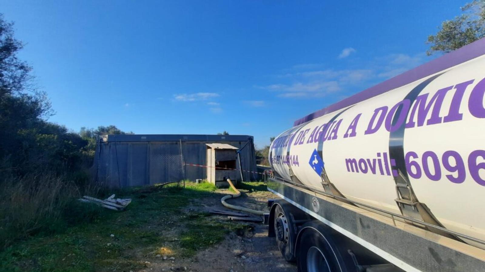 A water truck in the plain of Mallorca.