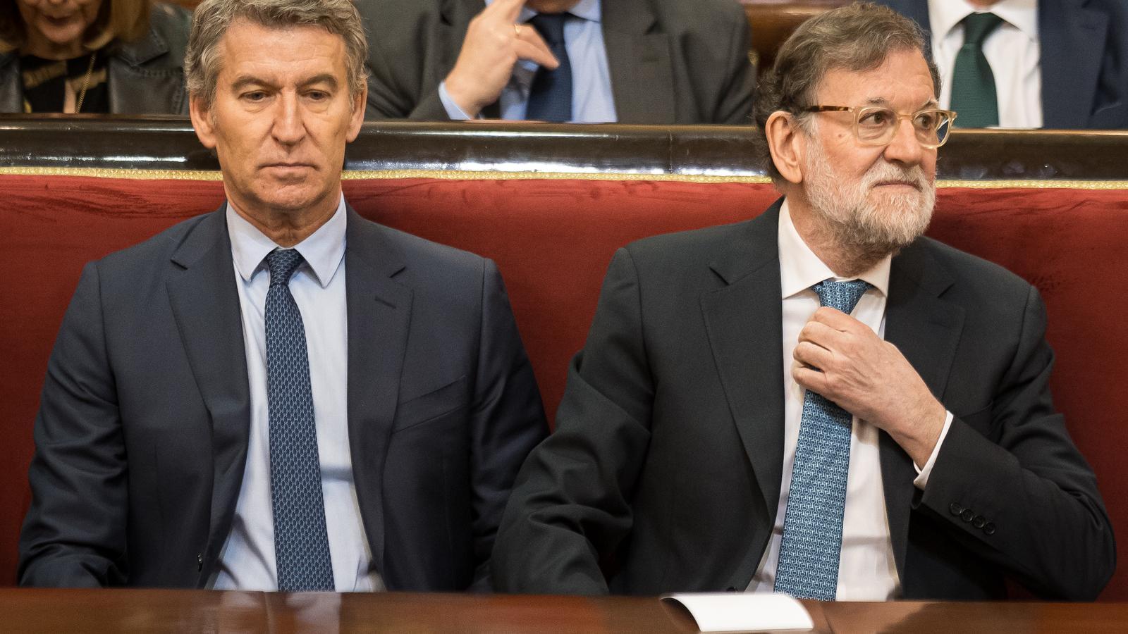 The president of the Popular Party, Alberto Núñez Feijóo, and the former President of the Government Mariano Rajoy, during the presentation of the book 'El Rey' by Manuel García-Pelayo, in the Senate.
