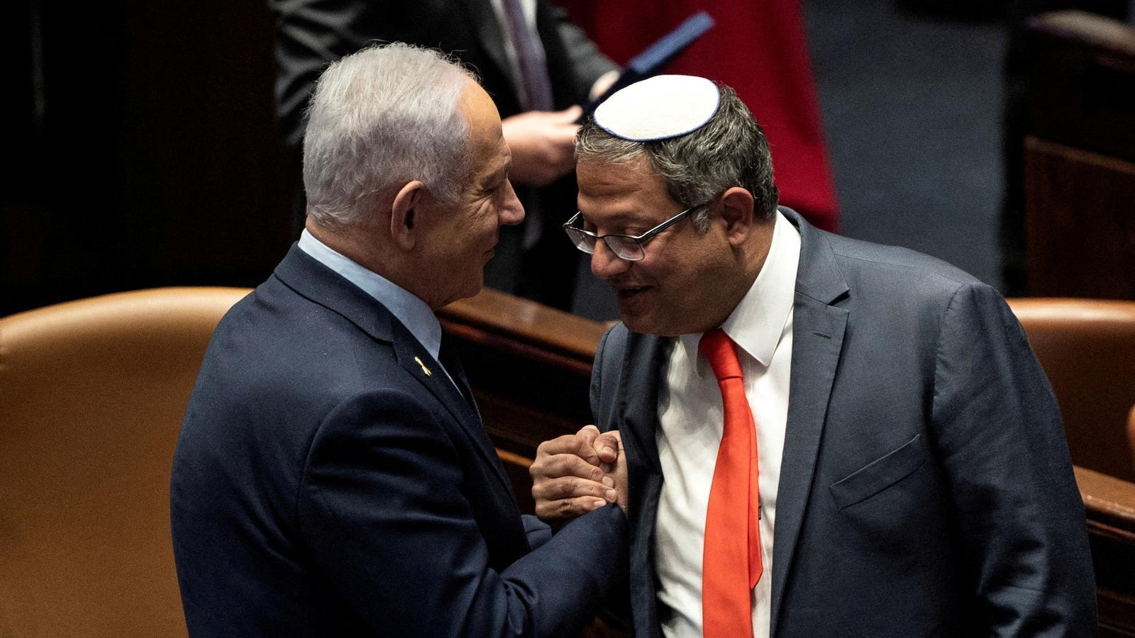 Itamar Ben-Gvir (right) with Israeli Prime Minister Benjamin Netanyahu, in the Israeli parliament, in a file image.