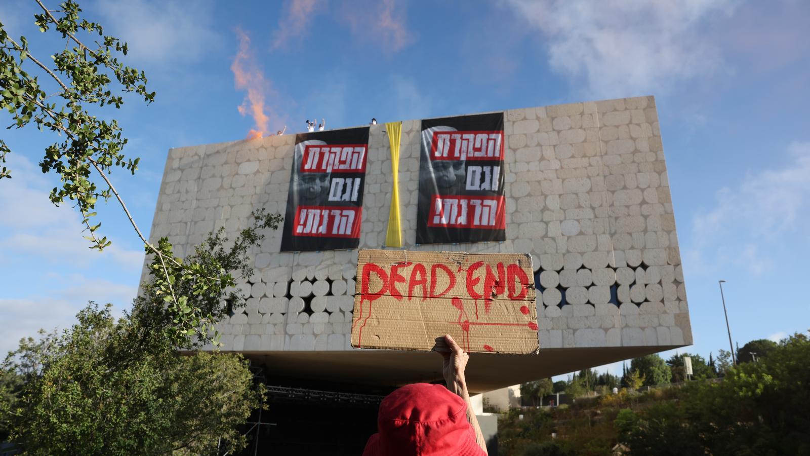 A group of protesters calling for the release of hostages and an end to the war demonstrate on the roof of the National Library in Jerusalem.