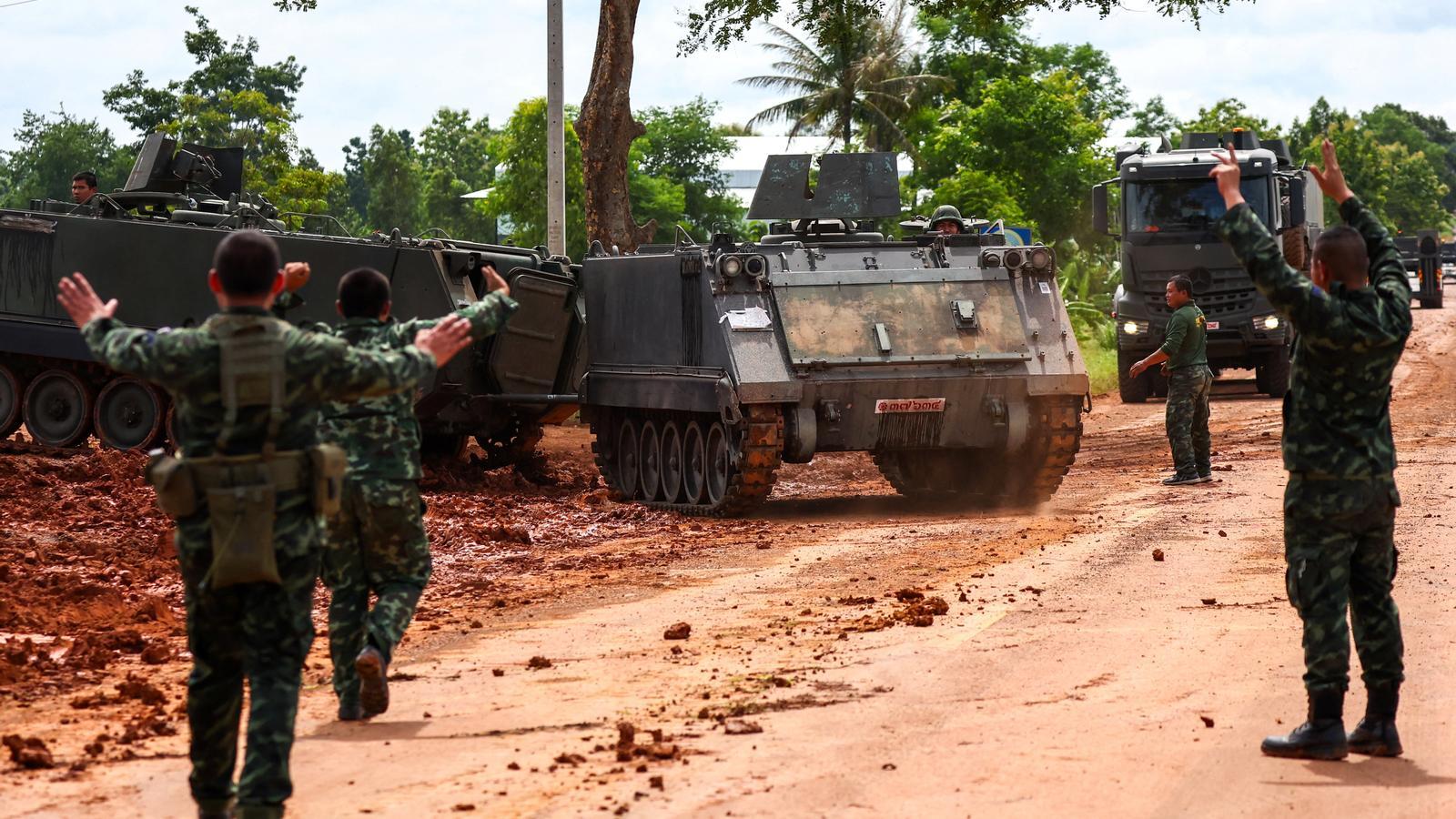 Armed personnel on the border between Thailand and Cambodia, the day after a ceasefire was signed following five days of fighting.