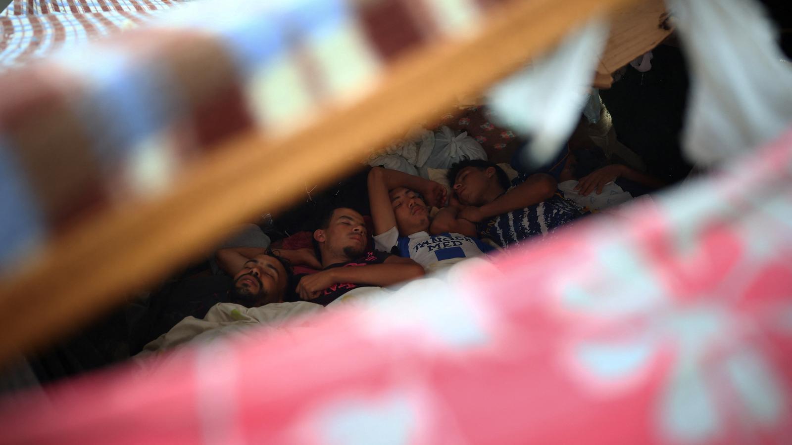 A group of young migrants sleeping at the El Trampolín Beach settlement, this Wednesday