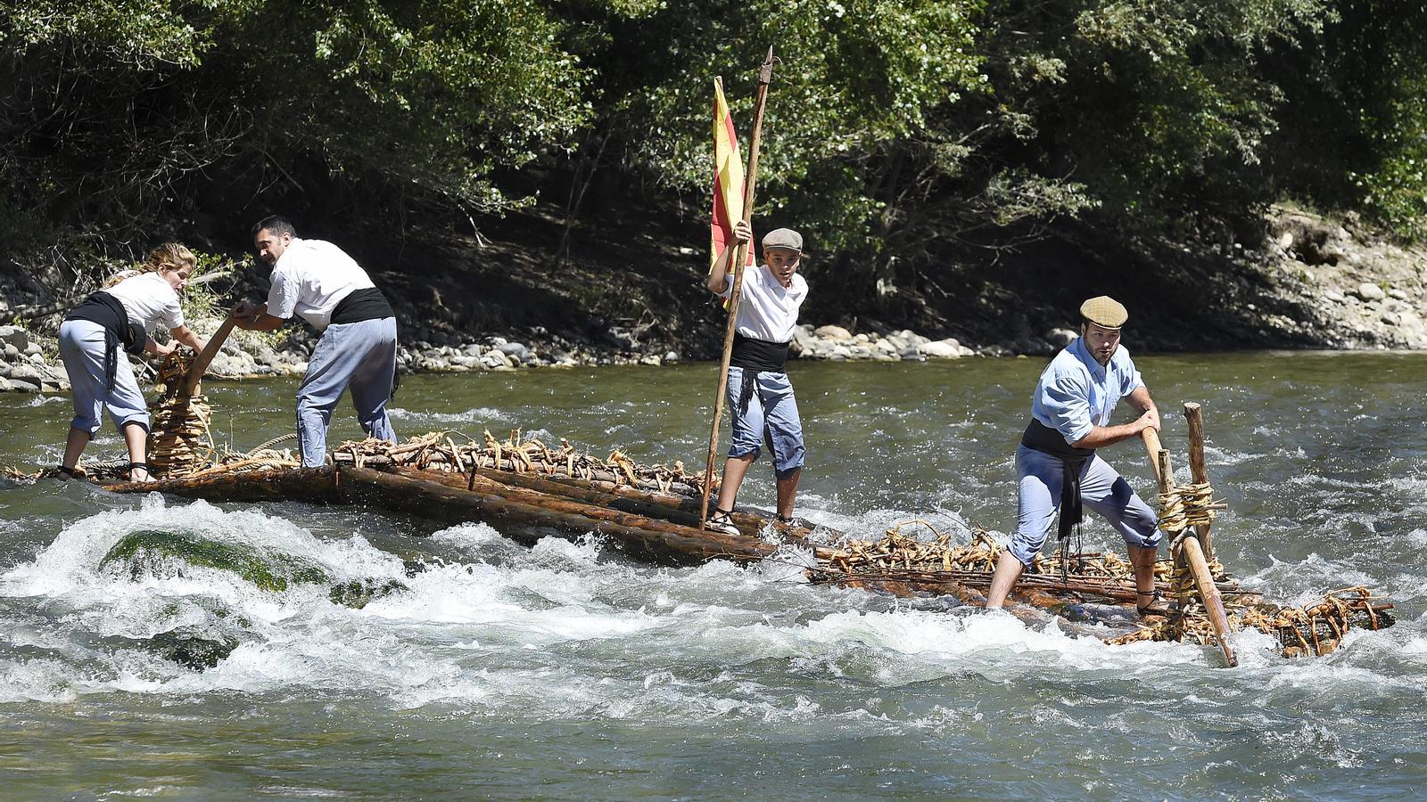 A group of rafters going down the river.