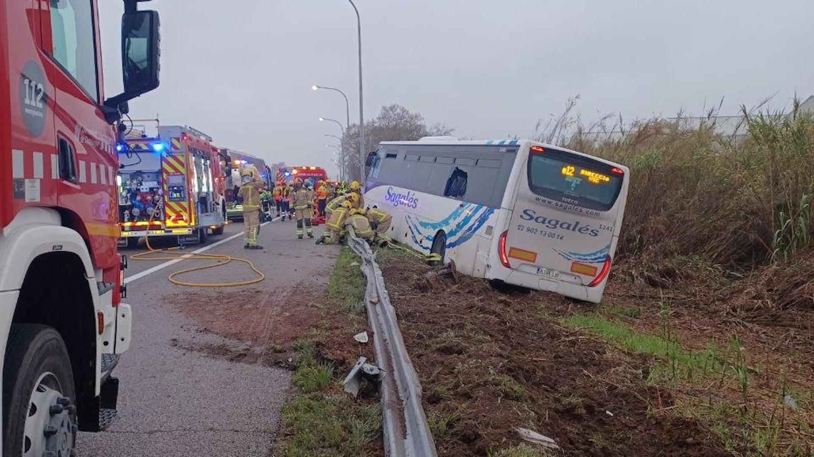 The affected bus was off the road and firefighters were working to stabilize it.