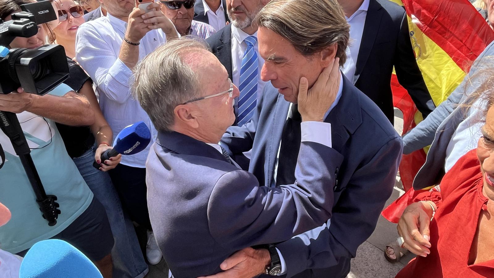 The former Spanish president José María Aznar greets the president of Ceuta, Juan Jesús Vivas