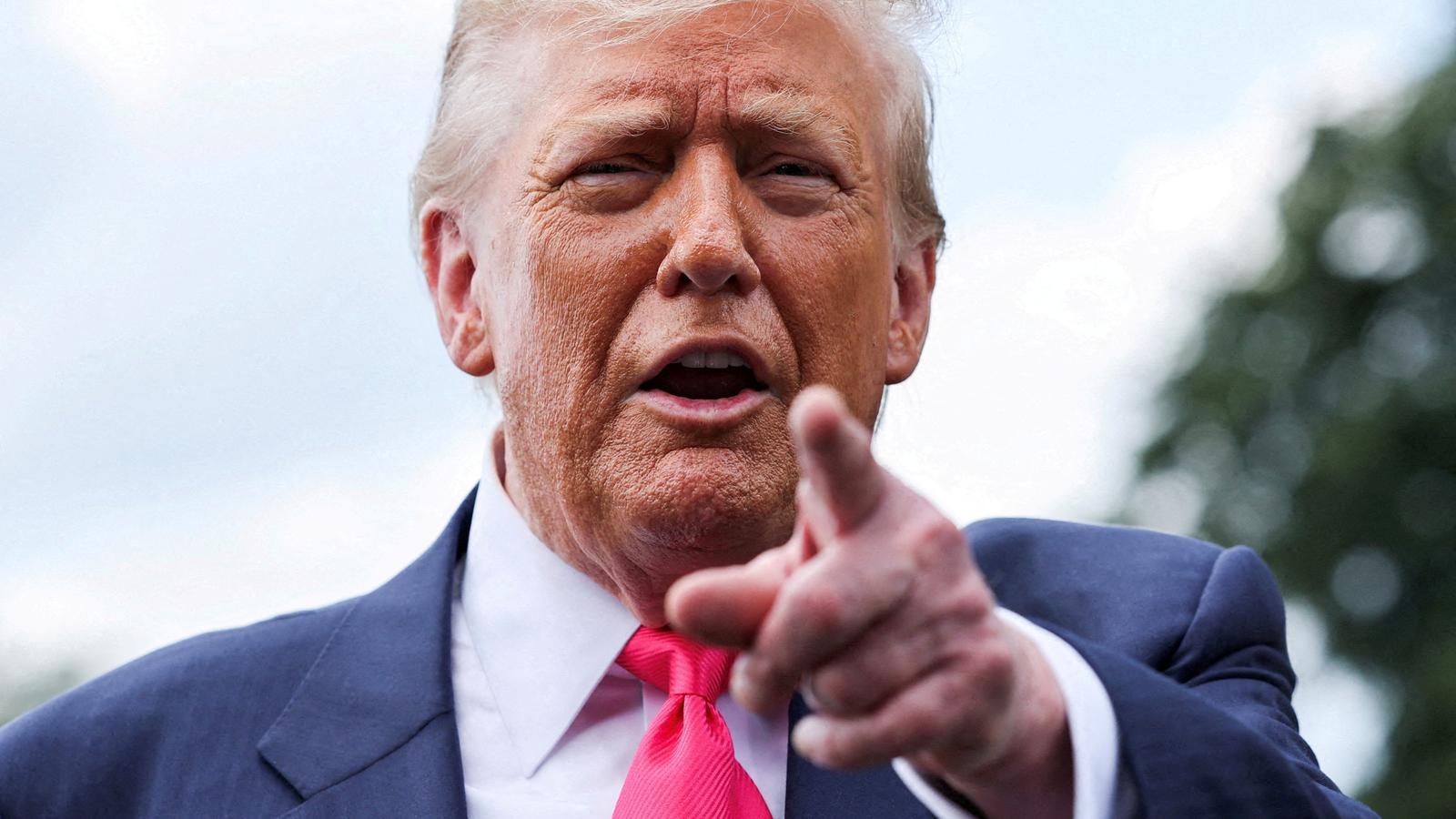 Donald Trump speaking to reporters in front of the White House.
