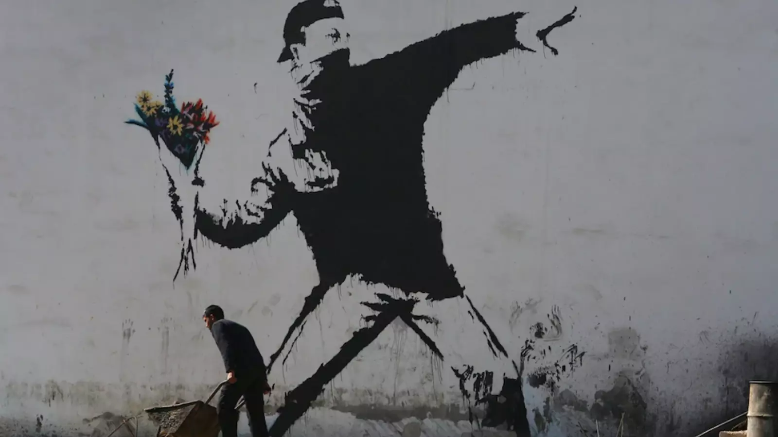 El Llançador de Flors, una de les obres més conegudes de Banksy, apareguda a Jerusalem el 2003