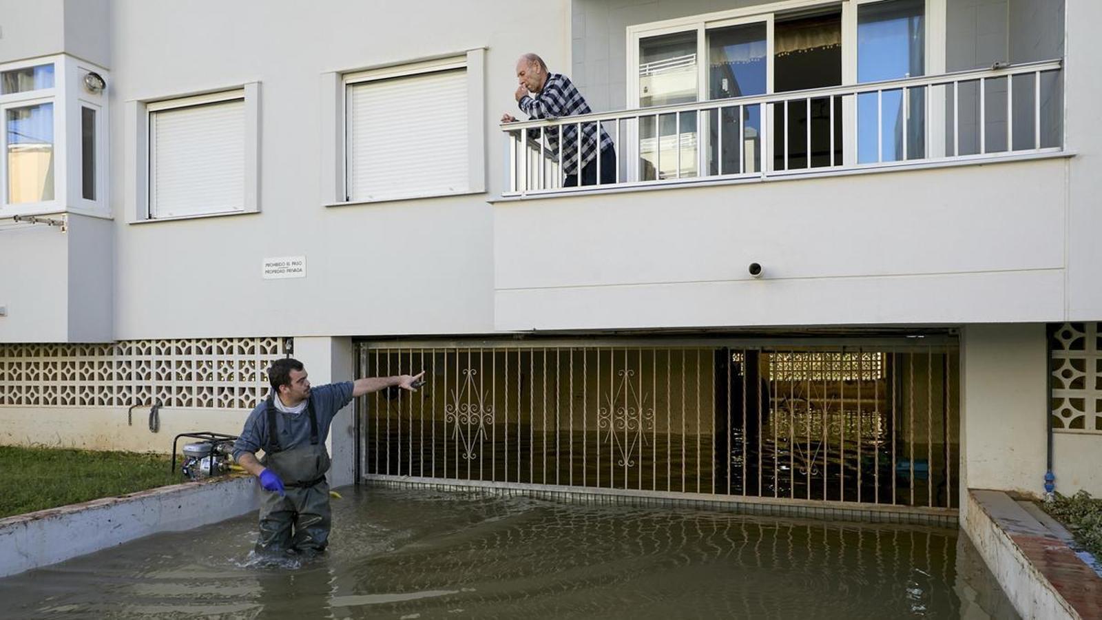 A worker works in the drain of a garage after the passage of the DANA Adam through the Valencian Country, which has left three fatalities, hundreds of evacuees and numerous material losses.