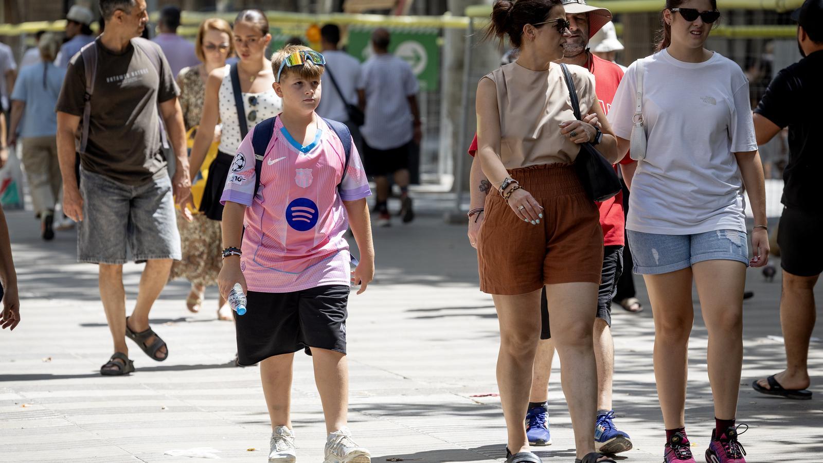 A boy wearing an unofficial T-shirt in downtown Barcelona.
