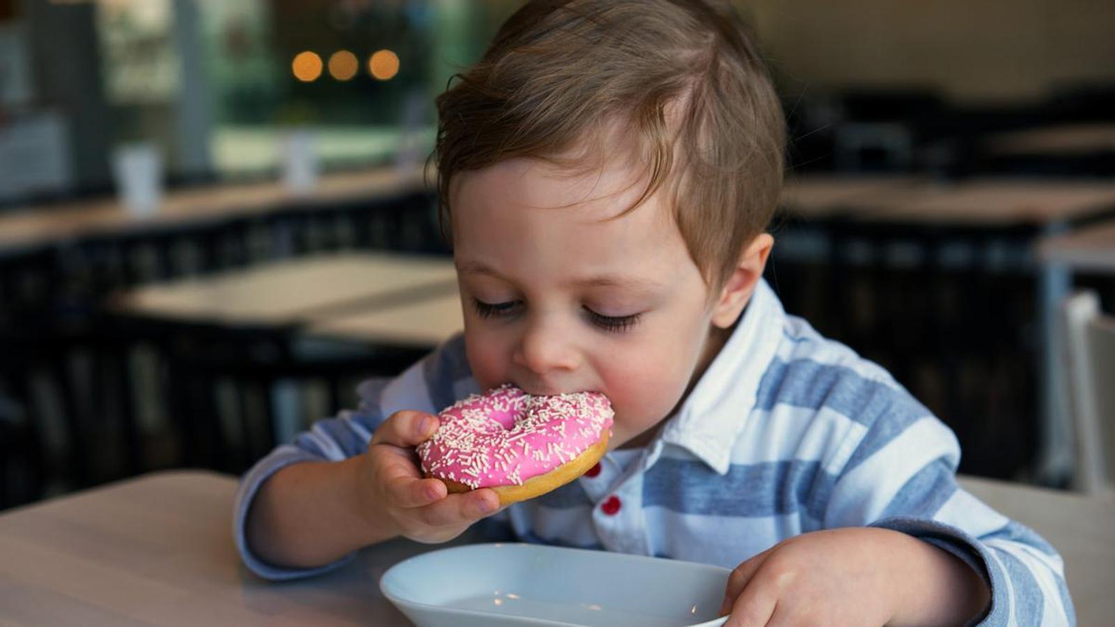A boy having breakfast at school.