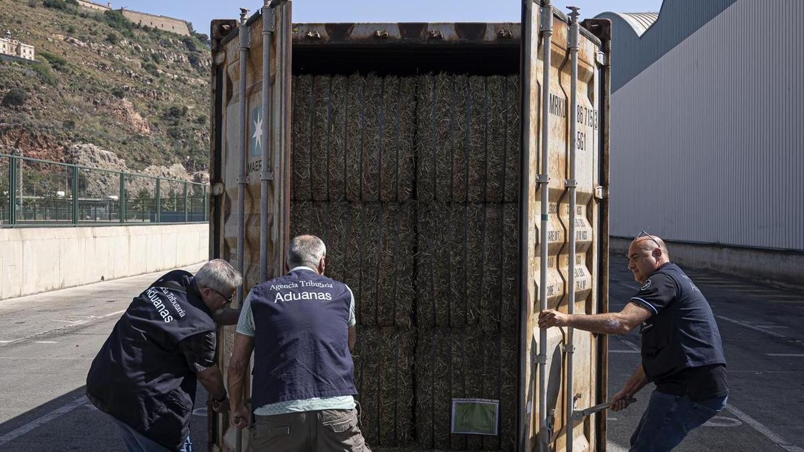 Customs Surveillance Agents opening a container at the Port of Barcelona.
