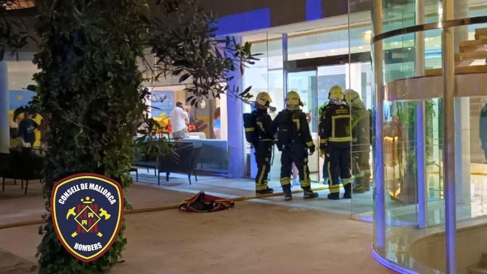 Firefighters act on the fire declared at the hotel